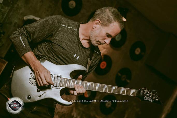 Marc playing guitar.